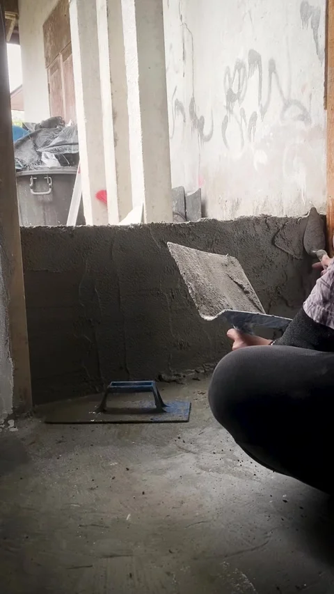 Cement plaster on brick wall construction Video stock 332567451