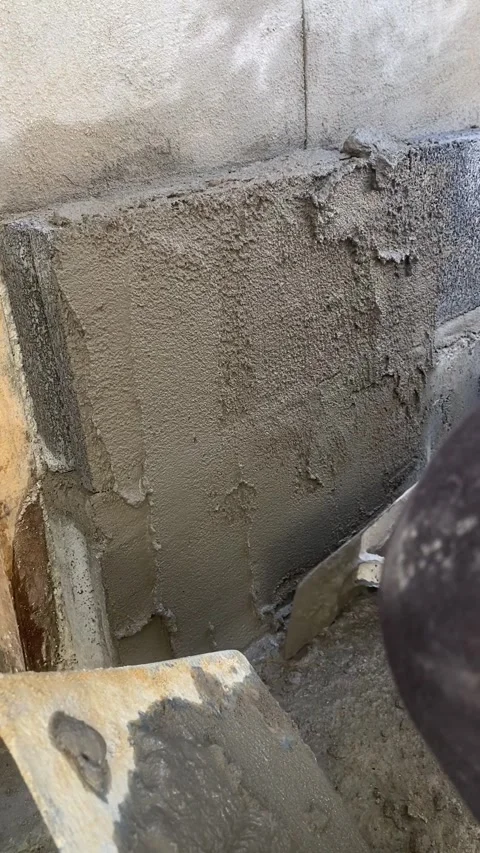 Cement plaster on brick wall construction Video stock 332567464