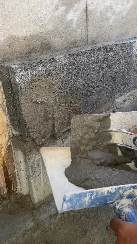 Cement plaster on brick wall construction Video stock 332567468