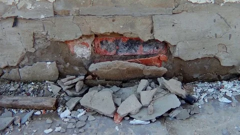 Cement plaster fell off the brick wall Stock Footage 74405120