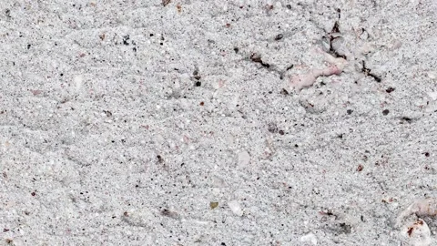 Cement plaster rough with streaks and inclusions rotating, turning, close-u.. 스톡 동영상 256323242