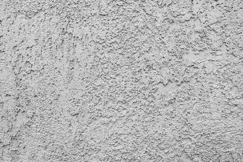 Cement plaster wall texture showing rough grainy surface application Stock Photos