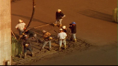 Cement pour with construction workers lower level Video stock 145607232