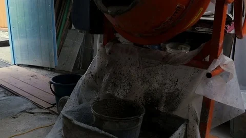 Cement is poured into a bucket Stock-Footage 80295552