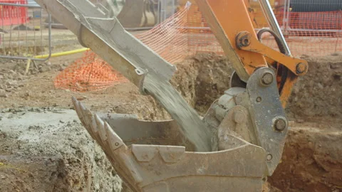 Cement Pours From Funnel Into Digger Claw 스톡 동영상 239704611