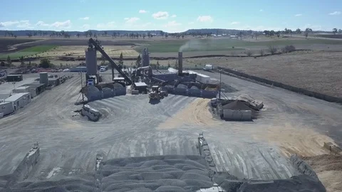 Cement processing plant front-end loader tilt shot Stock Footage 78536280