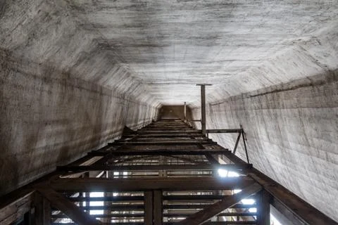 The cement silo represents data silos in computer science, which isolates dat Stock Photos
