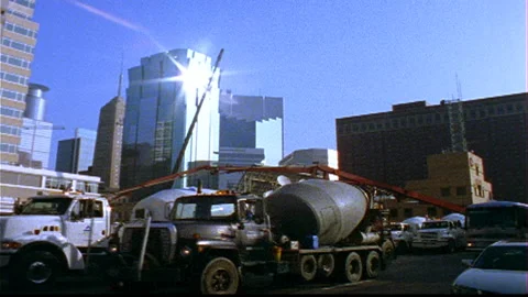 Cement Trucks positioning at downtown construction site Stock Footage 145608395