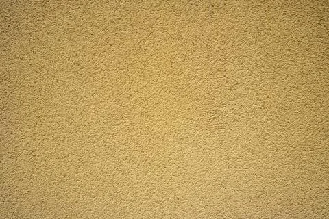 Cement wall background texture yellow Stock Photos