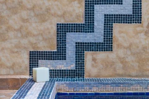 The cement wall decorates with blue tile Stock Photos