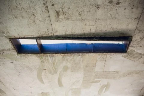 Cement wall with rectangle hole sewerage and electricity wiring Foto stock