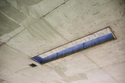 Cement wall with rectangle hole sewerage and electricity wiring Stock Photos