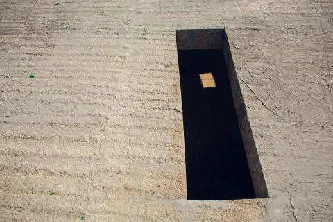 Cement wall with rectangle hole sewerage and electricity wiring Stock Photos