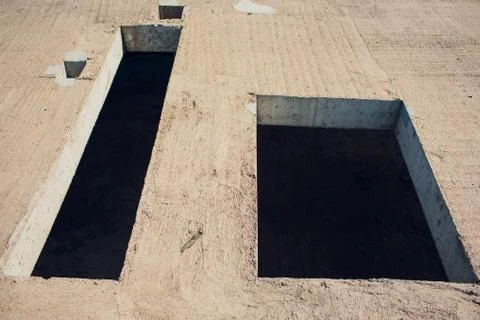 Cement wall with rectangle hole sewerage and electricity wiring Foto stock