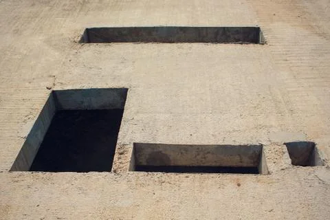 Cement wall with rectangle hole sewerage and electricity wiring Foto stock