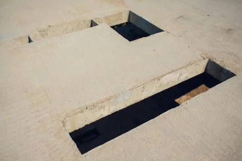Cement wall with rectangle hole sewerage and electricity wiring 스톡 사진