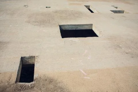 Cement wall with rectangle hole sewerage and electricity wiring Foto stock
