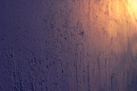 Cement wall with roughness, cracks and bumps. Abstract grunge background. Stock Photos