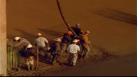 Cement Workers tight group pour brown concrete Video stock 145610342