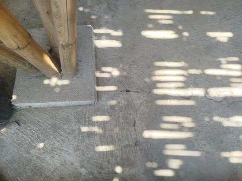 Cemented bamboo house support pillars on the ground 스톡 사진