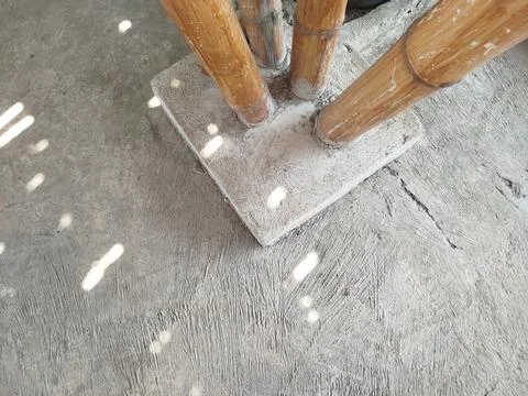Cemented bamboo house support pillars on the ground 스톡 사진