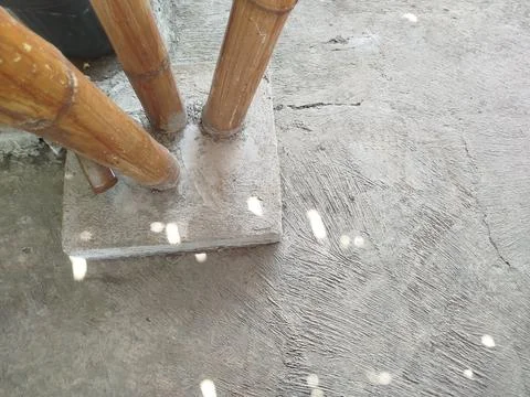 Cemented bamboo house support pillars on the ground 스톡 사진