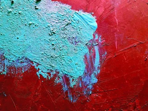 The cemented surface has a red backdrop and is plastered with blue. Foto stock