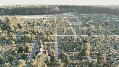 Cemetery with graves. Drone flying over old cemetery at sunrise. Graveyard with Stock Footage 158536025
