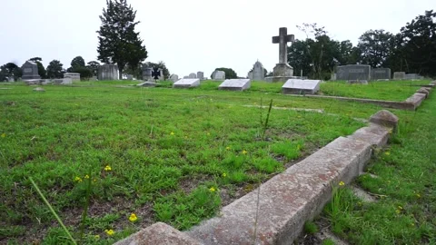 Cemetery Graveyard panning from right to left from a low angle. Stock Footage 245494728