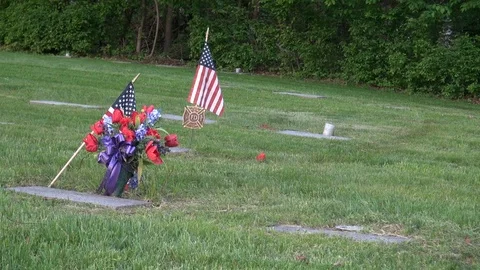 Cemetery plot of a US soldier and a firefighter Stock Footage 98710465