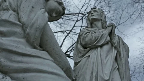 Cemetery Praying Statue Branches In the Wind 01 MP4 Video stock 70111409
