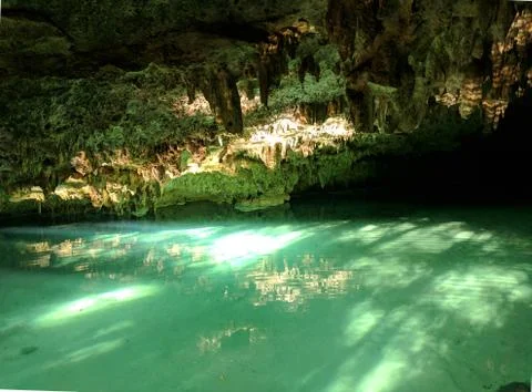 Cenote Pet cementary, light reflecting on water & stalagmites, near Tulum Mexico Stock Photos