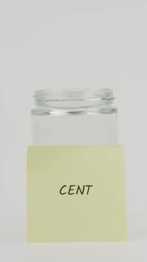Cent text or word on yellow sticky note attached to glass jar with hand Stock Footage 311690292