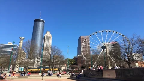 Centennial Olympic Park slow motion cityscape and ferris wheel Stock Footage 238575098