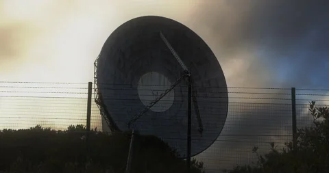 Center frame, circular, parabolic antenna with evening sky timelapse Stock Footage 160735650