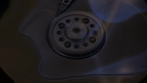 Center Hard disk burns in blue and yellow flames after its spilling alcohol Stock Footage 73689940