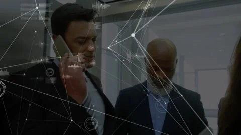 Center man calling, team using devices, HUD overlaying data over screens in Stock Footage 334039098