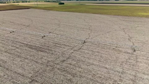 Center-pivot irrigation system over dry farmland near Debrecen, Hungary. Stock Footage 347055195