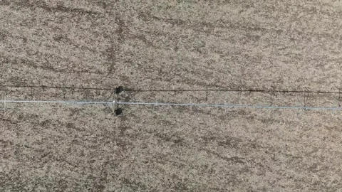 Center-pivot irrigation system over a dry field near Debrecen, Hungary 스톡 동영상 347055208