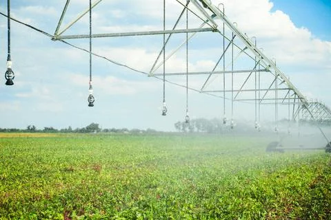 Center pivot irrigation system watering agricultural field Stock Photos