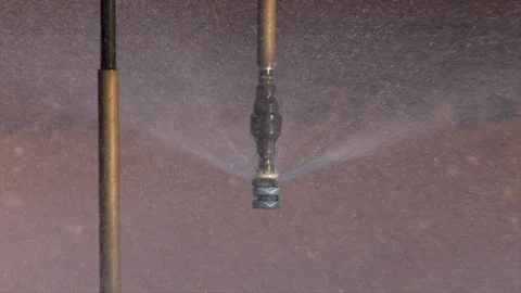 Center pivot sprinkler head close as water sprays out. Stock Footage 88747146