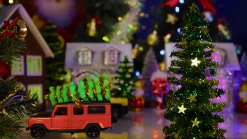 In the center of the town, two multi-colored cars drive up to the houses Stock Footage 317977972