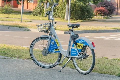 Centered bicycle with reflector on sidewalk, part of City Bike Program, Bik.. 写真素材