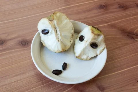 Centered close view of two chunks of cherimoya fruit Annona cherimola Stock Photos