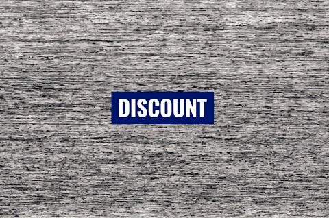 Centered discount icon label on distressed rustic grey wood surface stock illust Stock Photos