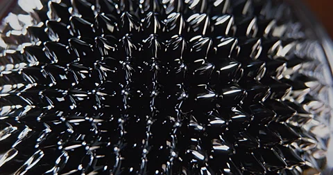 Centered macro shoot of a ferro fluid black liquid surface Stock Footage 152417234