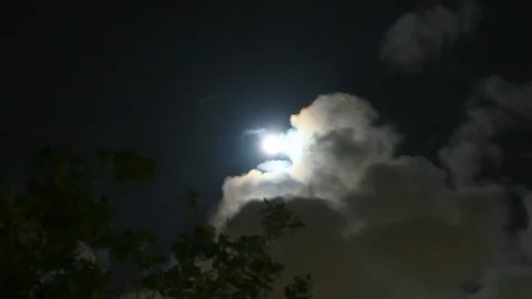 Centered Moon as clouds move at night Stock Footage 106405361
