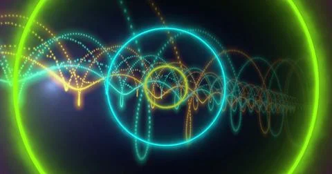 Centered neon cyan ring enclosing yellow neon ring glowing in space with green 스톡 사진