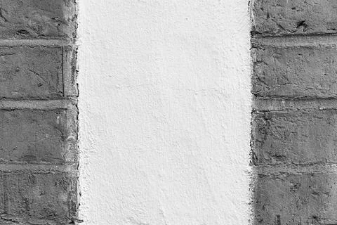 Centered Plaster Field Framed by Brick  Minimalist Texture 스톡 사진