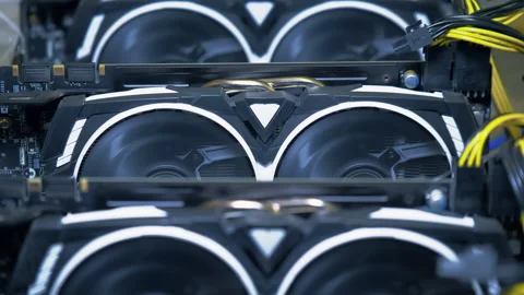 Centered rows of active graphics cards in open GPU mining rig Stock Footage 345092464
